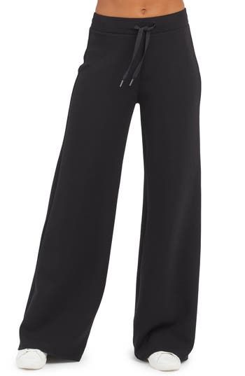 These throw-on-and-go pants is made from spacer fabric that's engineered with a cushiony feel that's as light as air. 30" inseam, 26" leg opening, 12" front rise, 15" back rise (size medium) Elastic/drawstring waist 47% modal, 46% polyester, 7% elastane Machine wash, tumble dry Imported Wide Comfy Pants, Black Womens Dress Pants, Straight Leg Sweat Pants, Black Comfy Pants, Dream Clothes Pants, Winter Workout Clothes, Black Baggy Sweatpants, Black Wide Leg Sweatpants, Trending Pants