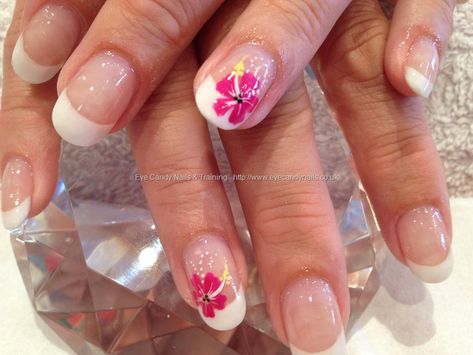 White acrylic backfill with freehand nail art Hibiscus Flower Nails Simple, White Nails With Hibiscus Flowers, White Hibiscus Flower Nails, Big Flower Nails, Pedicure Ideas For Hawaii, White French Tip Nails With Hawaiian Flower, Frangipani Nails, Hawaii Nails Ideas Simple, Hibiscus Pedicure