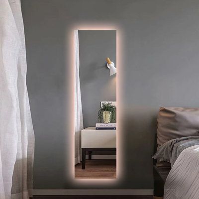 The copper-free mirror is fitted with an integrated LED strip light and add a touch of contemporary style to any bathroom setting. Display it either vertically or horizontally to suit your needs. Elevate your modern bathroom with the frameless mirror, it'll have both you and your home looking better. Light up your day with our LED wall mount bathroom make up mirror today! | Wrought Studio™ LED Backlit Rectangle Wall Mirror w / Smart App Control | Wayfair | Home Decor Long Mirror With Led Lights, Wall Mount Mirror, Lit Makeup Mirror, Mirror Led Lights Bedroom, Mirror With Lights Behind It, Illuminated Mirror, Light Up Mirrors, Back Lit Mirror, Mirror On Wall