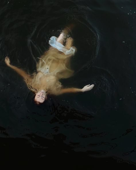 Girl in water, girl floating in a river, dark aesthetic, dark mermaid Mermaid Floating In Water, Laying In Water Photography, Woman Lying In Water, Floating On Water Aesthetic, Someone Floating In Water, Person Laying In Water, Dark Water Painting, People Floating In Water, Girl In Water Aesthetic