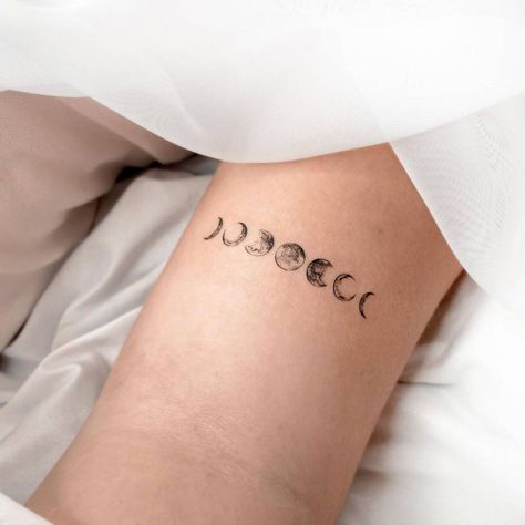 7 Moons Tattoo, Tiny Moon Phases Tattoo, Moon Phases Tattoo Back Of Neck, Moon Phases Tattoo Line Work, Moon Phases Tattoo Arm Band, Bicep Moon Tattoo, Phase Of The Moon Tattoo, Small Moon Phases Tattoo, Moon Phases Tattoo Thigh