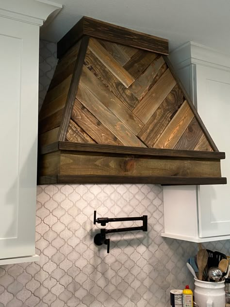 Pickets from Home Depot (both cedar and pine).  4 different stain colors.  Trim, power tools, and patience. Barnwood Range Hood Cover, Oven Hoods Wood, Barnwood Range Hood, Wooden Extractor Hood, Herringbone Range Hood, Stove Hoods Ideas Oven Range Over Island, Vintage Stove Hood, Rustic Kitchen Range Hood Ideas, Brick Hood Vent