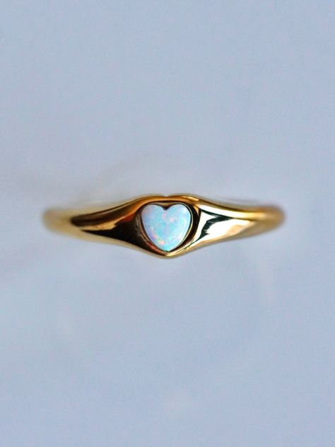 Perfect for every day, every look, and every aesthetic, the Opal Signet Ring is the perfect piece for any ring collection! The classic signet style is updated with a touch of Serendipity magic with a mesmerizing yet dainty opal heart taking center stage. Understated yet eye-catching, the opal signet ring is perfect for any stacked ring look or as a stand alone stunner. 💕 Don't know your ring size? View our Ring Size Guide …………………………………. RING SIZE & MATERIAL❋ water resistant 14k gold plated stai Signet Ring Aesthetic, Cute Promise Ring, Opal Heart Ring, Every Aesthetic, Unusual Rings, Gold Signet Ring, Ring Collection, Everyday Rings, Waterproof Jewelry