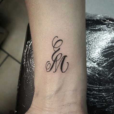 E and M 1st #tattos #tattooed #tattooing #lettering #letteringtattoo #letters #calligraphy #black #e #m Letter M Tattoos, Tattoo Alphabet, Ems Tattoos, Letters Calligraphy, 7 Tattoo, Favorite Tattoos, M Tattoos, Free Tattoo Designs, Monogram Tattoo