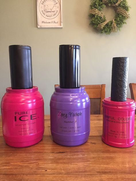 Giant nail polish for a spa party! Empty food containers, spray painted. Clear sticker paper for the label, and for the nail polish lid, for the bigger ones I used disinfect wipe containers and the small one is a bigger pool noodle, you could use styrofoam cones but they can get a bit pricey! Giant Nail Polish Bottle, Giant Perfume Bottle Prop, Nail Polish Valentine Box Ideas, Giant Makeup Props, Spa Birthday Ideas, Makeup Party Decorations, Beauty Party Ideas, Makeup Birthday Party, Chanel Birthday Party