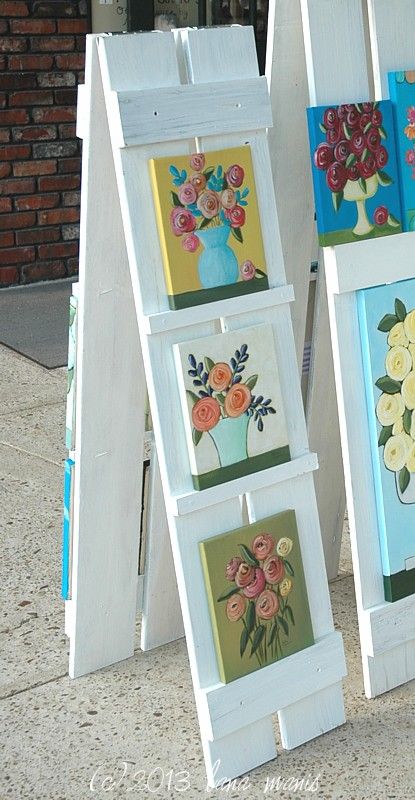 shutter easel lana manis Creative Ways To Display Artwork, How To Display Vinyl Decals To Sell, Vertical Display Ideas, Outdoor Display Exhibition, Diy To Sale, Backyard Boutique Ideas, Car Charm Vendor Display, Peg Board Display Ideas, Diy Trade Show Display