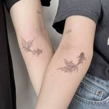 Trendy And Eye-Catching: 65+ Sibling Tattoos In 2023 Koi Carp Tattoo Women, Matching Pisces Tattoos, Koi Fish Tattoo Matching, Matching Koi Fish Tattoo, Pair Tattoos, Carp Tattoo, Maching Tattoos, Twin Tattoos, Artsy Tattoos