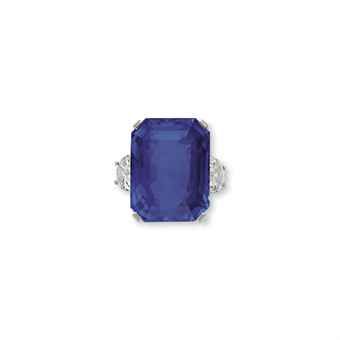 A SAPPHIRE AND DIAMOND RING, BY TIFFANY & CO. Set with a rectangular-cut sapphire, weighing ~ 63.65 carats, flanked on either side by a half-moon diamond, mounted in platinum. Sapphire And Diamond Ring, Tiffany Co Jewelry, Jewelry Ring, Girls Best Friend, Half Moon, Tiffany & Co., Amazing Jewelry, Sapphire Ring, Beautiful Jewelry