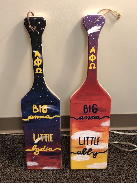 My completed twin paddles for my Littles that they will get on big little reveal for alpha phi omega!! Twin Sorority Paddles, Paddles Sorority Ideas, Frat Paddles, Diy Sorority Crafts, Paddles Sorority, Fraternity Paddles, Big Little Paddles, Greek Crafts, Paddle Ideas