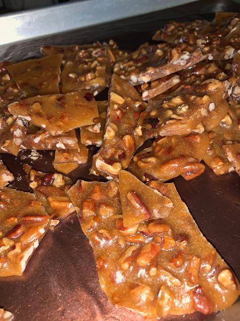 A recipe for pecan brittle. Pecan Brittle Recipe Best, Coconut Peanut Brittle Recipe, Pecan Brittle Recipe Easy, Boozy Deserts, Pecan Brittle Recipe, Nut Brittle Recipe, Praline Pecans Recipe, Roasted Pecans Recipe, Boozy Food