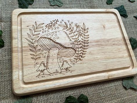 Mushroom chopping board, Engraved bread board, House warming gift, Personalised house warming present, Cottage core gift, Mushroom lover #woodslicemagic #diyhomedecor #sustainablecrafts #naturalart #woodslicedecor #diygiftideas #Woodworking #WoodworkingTips #WoodworkingProjects #WoodworkingIdeas #WoodCraft #WoodArt #DIYWoodworking #WoodworkingCommunity #HandmadeWoodwork #WoodworkingSkills #WoodworkingLife #WoodworkingInspiration #WoodworkingCrafts #WoodworkingDesign #DIYWoodGingerbreadHouses Board House, Wood Slice Decor, Wood Burn Designs, Laser Cut Wood Crafts, Woodburning Projects, Woodworking Inspiration, Wood Burning Crafts, Wood Burning Patterns, Wood Burning Art