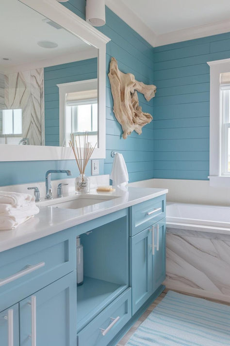 40 Coastal Bathroom Ideas for a Tranquil Beach-Inspired Home Coastal Theme Bathroom, Blue Kitchen Interior, Coastal Bathroom Ideas, Modern Farmhouse Bathroom Ideas, Blue Bathroom Walls, Blue Bathroom Interior, Light Blue Bathroom, Coastal Bathroom Design, Coastal Bathroom Decor