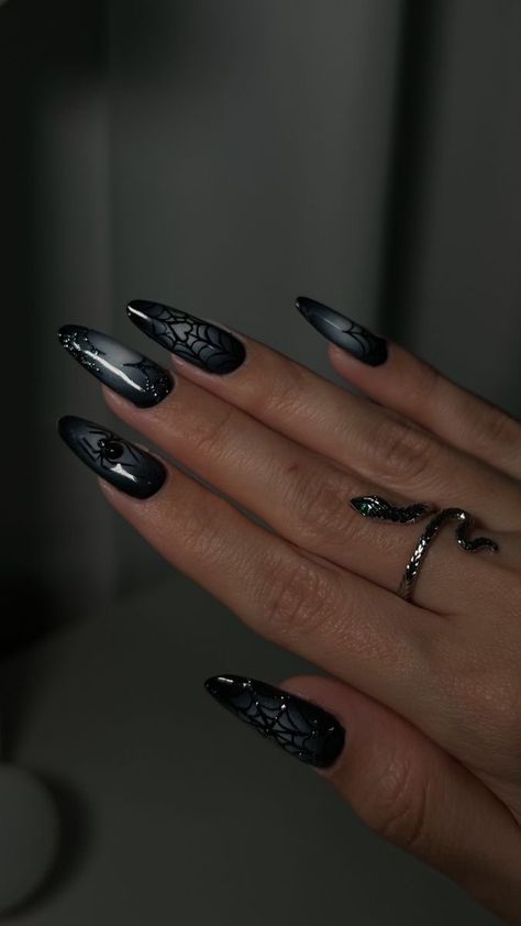 Black Nail Inspo With Rhinestones, Spider Inspired Nails, Spiderweb Almond Nails, Black Nails Acrylic Halloween, Punk Halloween Nails, Plum Halloween Nails, Nails With Metallic Design, Halloween Nails With Glitter, Spider Themed Nails