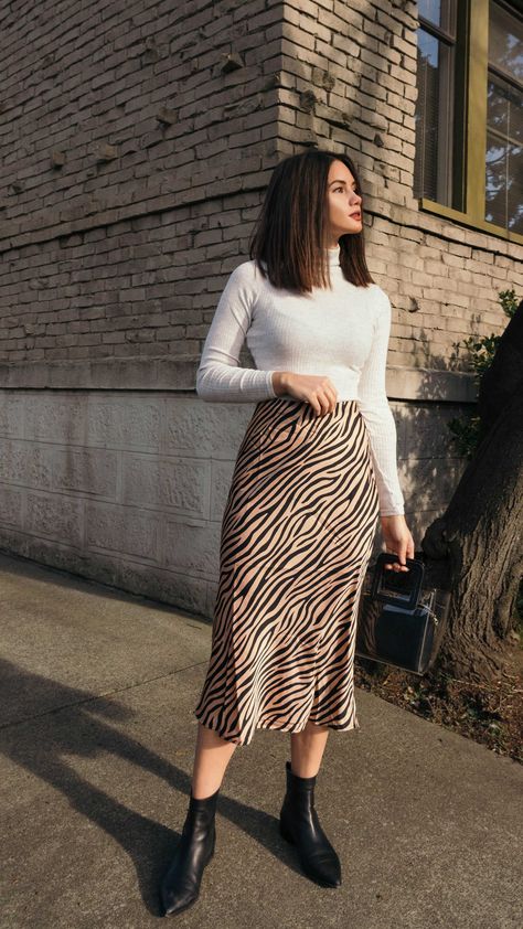 Tiger Print Midi Skirt. Click to shop this outfit. Work Outfits Women Midi Skirt, Skirts And Long Sleeves Outfits, H&m Skirts Outfit, Skirt Outfits Ideas Casual, Women Winter Skirt Outfits, Skirts Autumn Outfit, Long Skirt Outfits For Office, Winter Outfits Skirt Midi, Midi Skirt For Fall