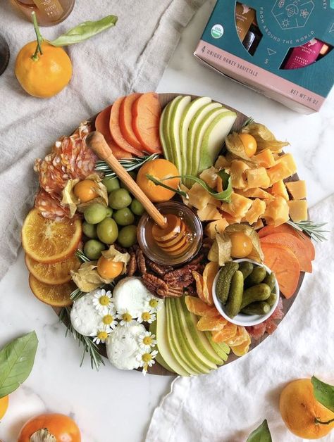 Looking for an impressive charcuterie board idea or cheese platter for your friends and family this holiday season? Try this board made with fresh fruits, meats, cheeses, and of course our Brazilian Quince Honey - Marmeleiro by Bee Seasonal. This platter is great for feeding a crowd during Christmas, Thanksgiving or the holidays! #charcuterieideas #cheeseboard #cheeseplatter #beeseasonal #beeseasonalhoney Recipes With Honey, Honey Gift Basket, Yogi Food, Cheese And Honey, Beautiful Cheese Board, Last Holiday, Creative Recipes, Honey Gifts, Charcuterie Inspiration