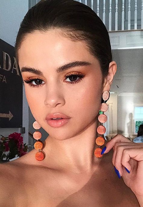 Celebrities proclaim this to be the hottest eye-shadow color for spring... see how they're styling these beauty must haves...Love this darker neutral on Selena Gomez Selena Gomez, Instagram, Make Up, Orange Dress, A Woman, Choker Necklace, Hoop Earrings, Orange, Makeup