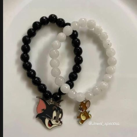 **Tom and Jerry Couple Bracelet** Celebrate your playful bond with these Tom and Jerry couple bracelets. Each bracelet features a charm—one with Tom and the other with Jerry—symbolizing the fun and unique connection you share. With adjustable straps for a perfect fit, these bracelets are a stylish and nostalgic way to express your love and a little friendly rivalry. #jewelspectra #handmade #asthetic #accessories #couplebracelet #tomandjerry #youth #trending #trendingnow #teenagefashion #feed... Tom And Jerry Couple, Friendly Rivalry, Couple Bracelet, Couple Bracelets, Tom And Jerry, Charm Bracelets, Adjustable Straps, Perfect Fit, Charm Bracelet