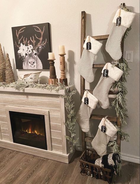 Stocking Ladder Diy, Stocking Blanket Ladder, Stockings On Electric Fireplace, Christmas Stockings Apartment, Christmas Stocking On Ladder, Christmas Decor Ladder, Ladder Xmas Tree Ideas, Christmas Decor Stocking Ideas, Stockings On A Ladder