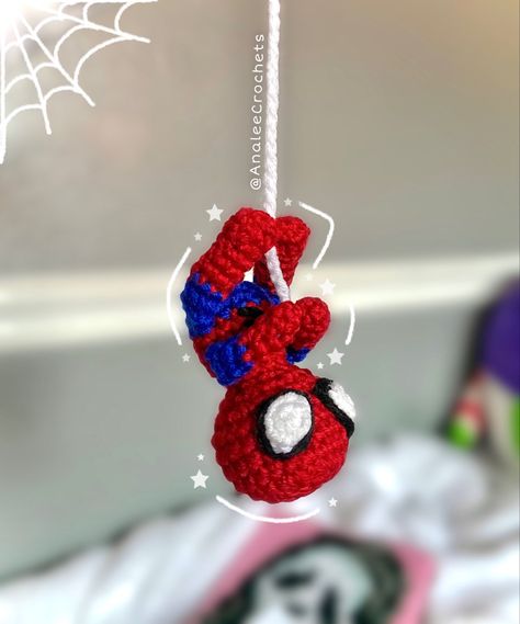 Crochet spiderman. Hanging upside down from a crochet spiderweb. Crochet Spider Man Amigurumi, Crochet Flowers Spiderman, Crochet Ideas Small Yarn, Mini Crochet Spiderman, Spider Man Crochet For Car, Spider Man Crochet Projects, Hanging Spider-man Crochet, Crochet Hanging Spiderman Pattern, Crochet Projects Spiderman