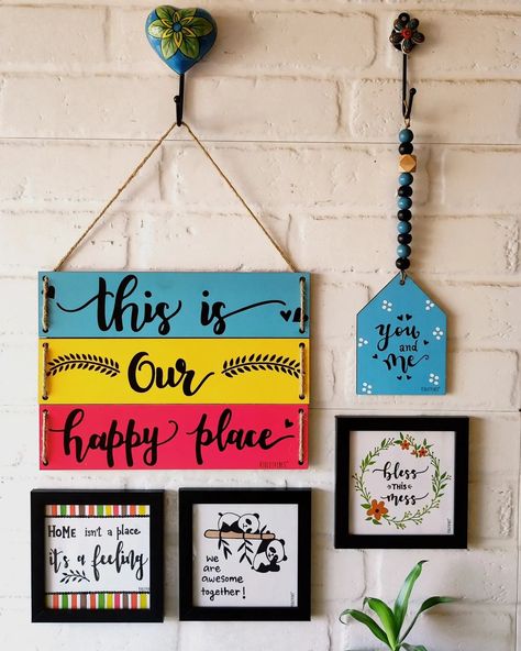 VIOLETVIBES® on Instagram: “We had to create a combo around our best selling multi tier wall hanging : 'This is our happy place' We will call it 'This is our happy…” Hanging Board On Wall, Balcony Diy, Basic Calligraphy, Hanging Quotes, Diy Wall Hanging Crafts, Warli Painting, Cardboard Crafts Diy, Popsicle Crafts, Wall Art Diy Paint