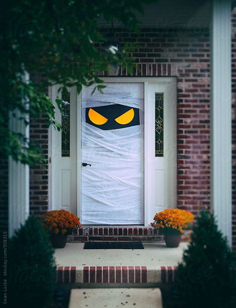 Spooky Halloween Door Wrapped Up As Mummy by sjlocke | Stocksy United Porta Halloween, Halloween Front Doors, Halloween Decorations Outdoor Porch, Halloween Front Door Decorations, Cheap Diy Halloween Decorations, Cheap Halloween Decorations, Halloween Diy Outdoor, Halloween Decor Diy, Photo Halloween