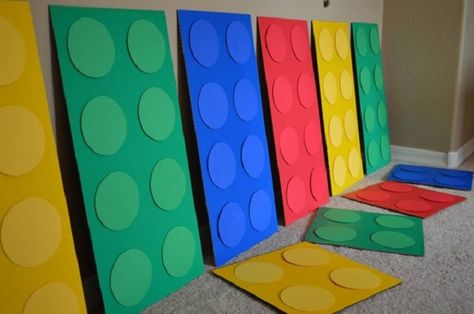 spray paint cardboard, add paper circles Diy Lego Blocks Cardboard, Legos Party Ideas, Lego Vbs, Building Leaders, Lego Party Ideas, Lego Party Decorations, Lego Movie Birthday, Paint Cardboard, Lego Movie Party