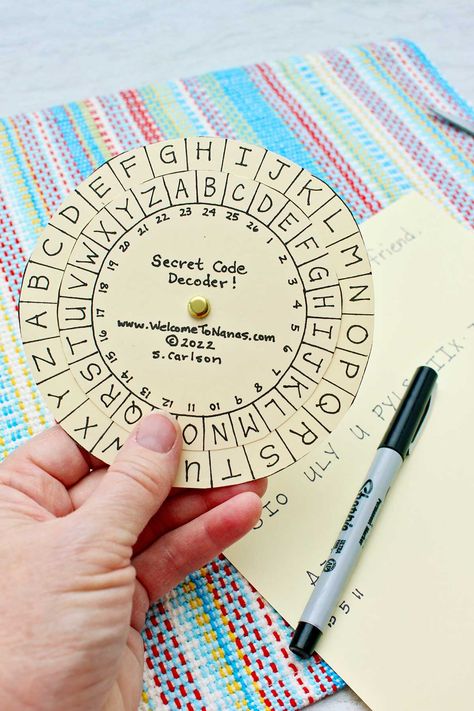 Kids can make their own DIY secret spy decoder wheel for writing and decoding secret messages. Use the free printable and make a secret code! #WelcometoNanas #MessageDecoder #DIYDecoderWheel #SecretMessageDecoder Diy Decoder Wheel, Secret Messages Code, Secret Message Origami, Diy Spy Kit, Secret Words Codes, Secret Message Ideas, Game Pieces Diy, Spy Activities For Kids, Homemade Escape Room