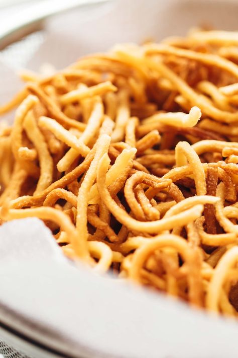 Learn how to make your own crispy fried noodles at home in five easy steps. These are great on Chinese soups, in a crunchy Chinese chicken salad, in American chopsuey or just served as is with sweet and sour chicken. #asian #noodles #friednoodles #homemade #thai Pan Fried Noodles Chinese Crispy, Chow Mein Noodles Recipe Crunchy, Chinese Fried Noodles, Crispy Fried Noodles, American Chopsuey, Chinese Salads, Crunchy Noodles, Manchow Soup, Chinese Soups