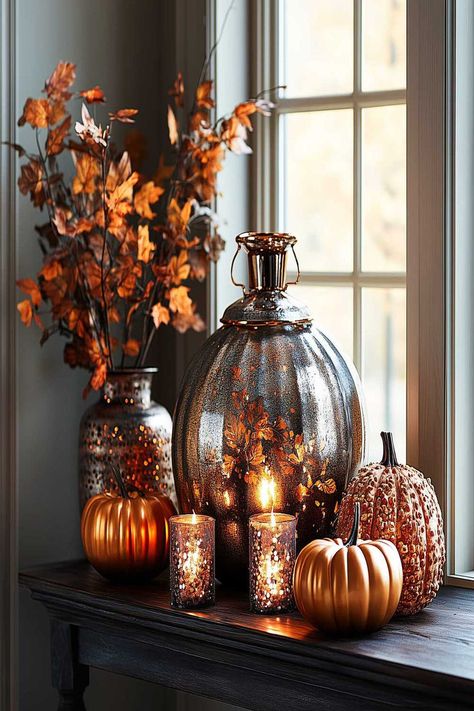 Urban modern fall decor with metallic pumpkins and candlelight. Autumn Decorating Ideas, Modern Fall Decor Ideas, Fall Decor Bedroom, Fall Home Decor Ideas, Modern Fall Decor, Neutral Fall Decor, Fall Living Room Decor, Metal Pumpkins, Cozy Fall Decor