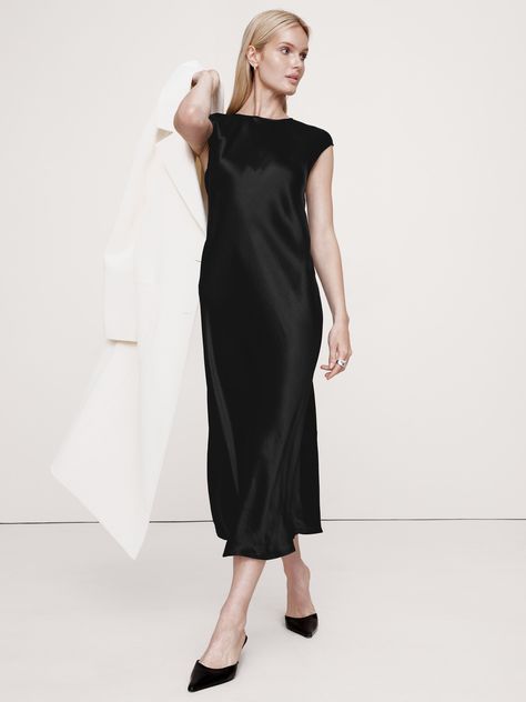 Our version of the season's slip dress styles, we cut this one from a luxuriously soft and silky satin quality, which we cut on the bias to achieve a beautiful drape.  Fit & flare.  Sustainability: Made with LENZING™ ECOVERO™, a breathable fiber derived from certified renewable wood sources, produced using methods that reduce water impact and emissions by up to 50% compared to traditional viscose.  Crew neck with button-keyhole at back.  Unlined.  Fit & flare.  Sleeveless.  Midi length.  Model: Bias Dress, Quoi Porter, Wedding Guest Dress Summer, Satin Midi Dress, Workwear Dress, Black Midi Dress, Dress Styles, Wide Leg Trousers, Fit & Flare