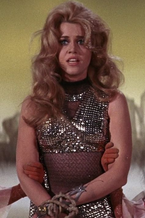 🚀✨ Dive into the cosmic allure of Barbarella! 🌌💋 From iconic comics to sizzling movies, she's the ultimate symbol of sci-fi sexiness. 🔥💄 Embodied by the stunning Jane Fonda, Barbarella blends fearless adventure with unmatched style. 🌟💥 Get lost in her universe of glamour, power, and irresistible charm! 💫💃 Ready to embrace your inner intergalactic goddess? 👑🌠 #Barbarella #CosmicQueen #SciFiGlam 👠🚀 Barbarella Movie, Jane Fonda Barbarella, Futurism Fashion, Personality Quotes, Disco Glam, Rocky Horror Show, Cult Movie, Sci Fi Fashion, Scantily Clad