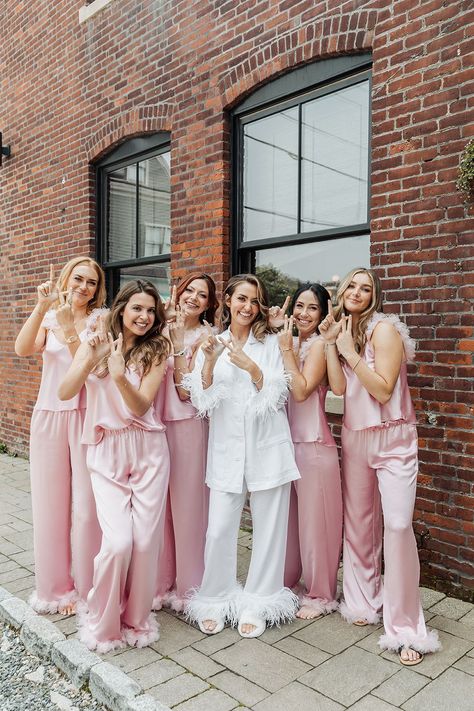 Bride and Bridesmaids in Silk PJs | Capture the joy and excitement of your wedding morning with your besties! These matching satin pajamas and fun vibes make for the perfect getting-ready photos. Book Kathy as your editorial wedding or Newport wedding photographer at simplykstudios.com! Bridesmaids Getting Ready Pajamas, Pajama Wedding Theme, Bride And Bridesmaid Pajamas, Morning Of Bridesmaids Outfits, Morning Of Wedding Ideas Bridal Parties Outfits, Matching Bridesmaid Pajamas, Bridesmaids Matching Pjs, Bridal Party Pyjamas, Bridesmaid Pj Pictures