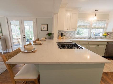 Removing a wall between this kitchen and dining room allowed for the addition of a large eat-in kitchen area featuring extended countertop space on the peninsula. The extra square footage made it possible for Erin and Ben to install an integrated gas range (less of a fire hazard) without compromising prep space. Left Side Kitchen Peninsula, Connected Island Kitchen, Kitchen Renovation U Shape, Stove Peninsula Kitchen, Kitchen With Island Attached To Wall, Kitchen Peninsula L Shaped, Narrow U Shaped Kitchen With Island, Extra Wide Kitchen Peninsula, Kitchen With Wide Peninsula