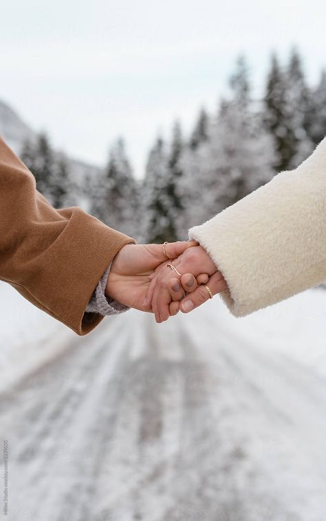 Crop women holding hands in winter snow by Milles Studio for Stocksy United Women Holding Hands, Winter Couple Pictures, Couple Photography Winter, Winter Engagement Photos Outfits, Snow Engagement Photos, Snow Engagement, Snow Couple, قلادات متدلية, Fall Home Decor Ideas