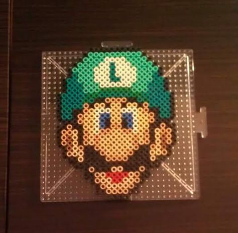 Luigi~ Perler Beads by CrimsonsCreations Perler Bead Luigi, Luigi Perler Bead Patterns, Nintendo Perler Beads, Luigi Perler Beads, Mario Perler Bead Patterns, Beads Quilt, Mario Perler Beads, Nintendo Perler, Hama Beads Mario