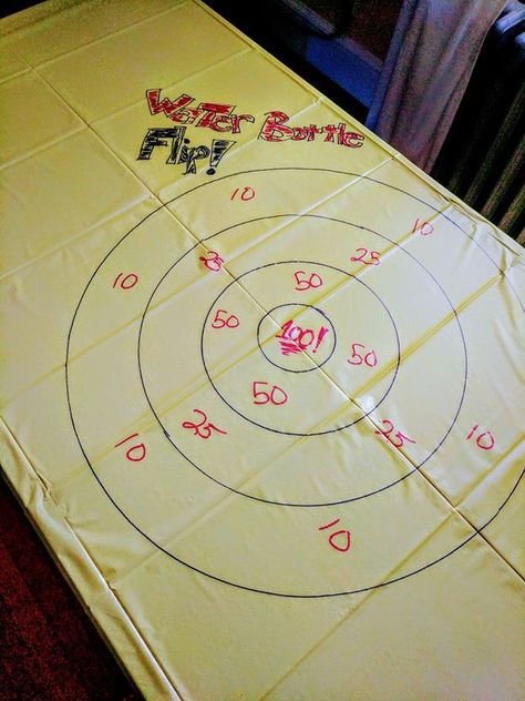 Fun for kids! Play darts' rules with water bottle flip. Dollar store vinyl table cloth and markers make an easy game table!! Bar Activities, Fundraising Plan, Darts Rules, Water Bottle Flip, Vinyl Table, Bottle Flip, Play Darts, Water Games For Kids, School Carnival