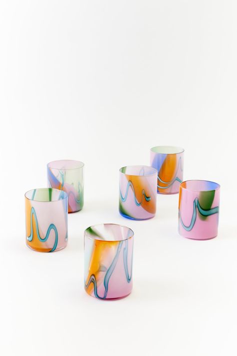 Set of six artfully designed tumbler glasses featuring a pastel color palette with wavy, marbled swirls of blue, pink, green, and amber. These unique hand-blown glasses bring a modern, artistic touch to any table setting, perfect for adding a pop of color and elegance to everyday dining or special occasions. Rainbow Glassware, Rain Bow, Glass Cupboard, Buffet Decor, Drinking Accessories, Antique Glassware, Colorful Ceramics, Stemless Wine Glasses, Linen Pillows