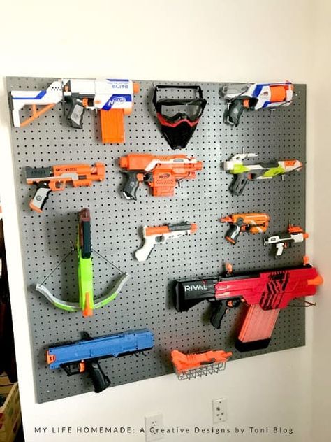 pegboard Nerf gun storage Nerf Wall, Nerf Storage, Boys Bedroom Storage, Remodel Garage, Army Bedroom, Spa Bedroom, Bedroom Storage Ideas, Kids Bedroom Storage, Diy Toy Storage