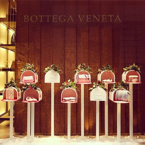 Bottega Veneta, Milan from Holiday Window Displays  The Italian leather brand keeps things simple and uncluttered this year for their display featuring handmade mailboxes filled with stylish gift ideas. Christmas Window Display Retail, Christmas Store Displays, Christmas Shop Displays, Valentines Window Display, Holiday Retail, Christmas Shop Window, Retail Ideas, Merchandising Ideas, Holiday Window Display