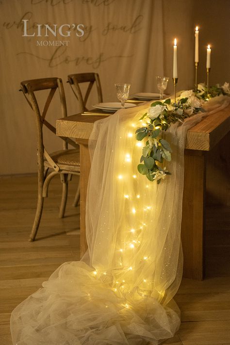 Tulle Table Runner With Lights, Tulle Eucalyptus Table, Fairy Lights Under Cheesecloth, Fairy Lights Table Runner, Tulle Decor Ideas, Square Cocktail Table Wedding, Tulle Ideas Decoration, Tule Table Runner, Bridal Shower Dinner Table Decor