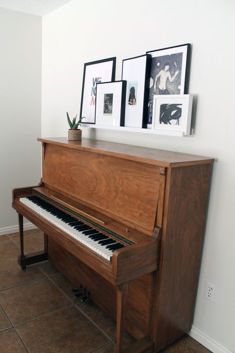 Picture frame ledge for over the piano                                                                                                                                                      More Piano Room Design, Piano Room Decor, Piano Living Rooms, Piano Ideas, Piano Decor, Piano Room, Upright Piano, Chris Loves Julia, Trendy Living Rooms