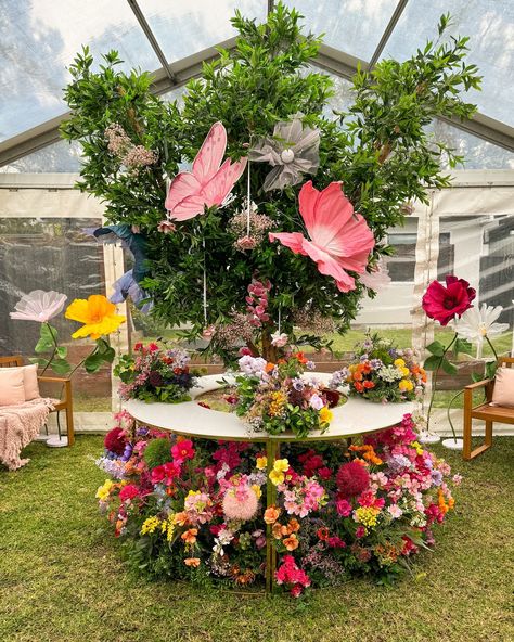 A magical 360° dessert table surrounded by florals, creating a dreamy enchanted garden for Kaldiye’s baby shower. Styling, decor, flowers and set up by @museweddingsandevents @kaldiyezreika Prom Enchanted Garden, Enchanted Table Setting, Wedding With Butterflies, Whimsical Table Decor, Fairy Garden Party Table Decor, Enchanted Garden Table Decor, Floral Event Decor, Enchanted Garden Decor, Enchanted Garden Decorations