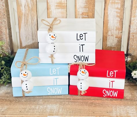 "Snowman Wood Book Stack          PLEASE READ MEASUREMENTS        BOOK STACK IS APPROXIMATELY                         ‼️ 4\"x 3.5\"x 2.25\" ‼️ Choose between white, red or blue.  This adorable book stack is perfect for accenting your home for Christmas. It would also be a perfect addition to your Tiered Trays, Coffee Bars, Cocoa Bars and Rae Dunn displays for the season!  Wood book stack is hand painted by me. I have added a vinyl decal and jute with snowman beads. Book stack is approximately 4\ Christmas Mini Book Stack, Winter Book Stack, Christmas Book Stacks, Snowman Beads, Diy Wood Books, Wood Books, Christmas Tiered Tray Decor, Books Christmas, Christmas Tiered Tray