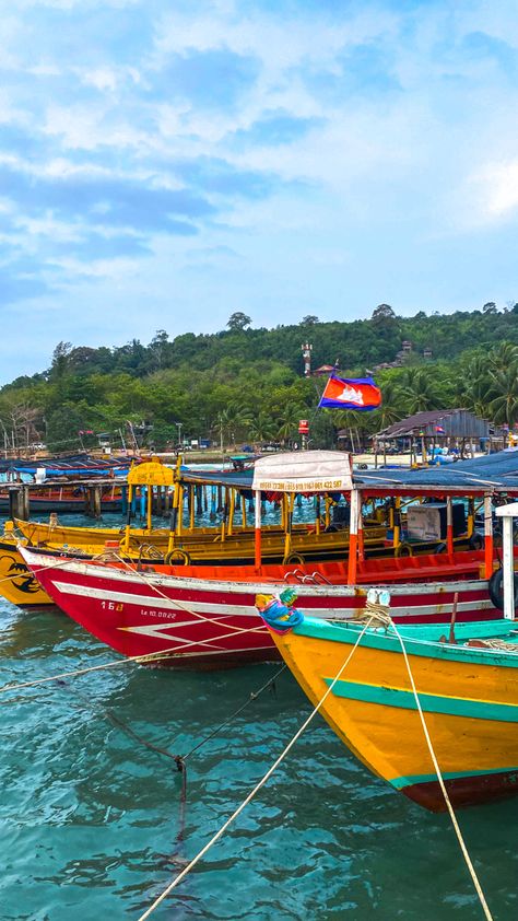 Colourful boats on turquoise blue waters in front of tropical island. Cambodia Koh Rong, Cambodia Travel Aesthetic, Southeast Asia Travel Aesthetic, Backpacking Southeast Asia Aesthetic, Loas Travel, South East Asia Travel Aesthetic, South East Asia Aesthetic, Southeast Asia Aesthetic, Cambodia Aesthetic