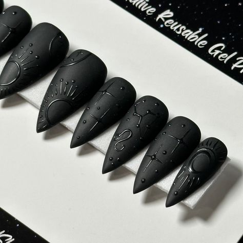 Welcome to LD Nails! 🖤 One set of 10 REUSABLE Press On Nails 🖤 🖤 Made to order in your shape & size 🖤 🖤 Black on Black: Zodiac. Velvet Matte black press on nails with glossy black zodiac detailing ♌️ ♊️ Leo & Gemini are pictured, Please leave a note with your sign in the personalization box, so I can customize it just for you! 🖤 Purchase INCLUDES an application kit! It consists of: 🖤 detailed application & removal instructions 🖤 a sealed and sanitary mani kit (100/180 file, buffer block, Matte Black Skeleton Nails, Punk Press On Nails, Zodiac Nails Designs Leo, Wedding Black Nails For Bride, Black Nails Press On, Matte Black Witchy Nails, Planchette Nail Art, Mismatch Halloween Nails, Square Matte Black Nails