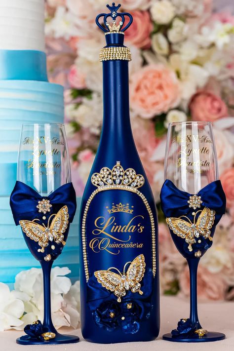 Celebrate in style with this stunning Quinceañera set, featuring a navy blue bottle adorned with delicate butterflies and two matching glasses. This elegant ensemble adds a touch of enchantment and sophistication to your special day. Quinceañera bottle set, navy blue decor, butterfly accents, Quinceañera glasses, elegant celebration, party decor, butterfly-themed, special occasion set, Quinceañera centerpiece, personalized keepsake Blue Butterfly Quinceanera Theme, Quinceanera Champagne, Butterfly Quinceanera Theme, Money Card Box, Quinceanera Theme, Sweet 15 Party Ideas, Quinceanera Centerpieces, Navy Blue Decor, Cake Knife Set