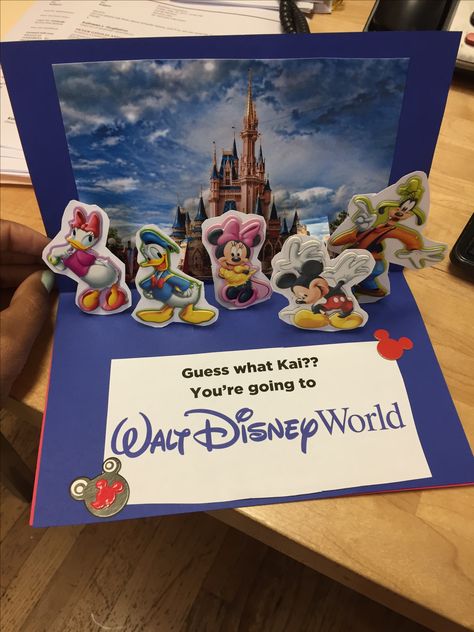 Creative Disney World / Disneyland surprise card. Pop up card. #popupcard #disney #disneyworld #disneyland #surprise Disneyland Surprise Reveal, We’re Going To Disney Surprise, Disney World Surprise Box Ideas, Disney Trip Reveal Ideas Kids, Disney Surprise Box Ideas, Disney Trip Ideas, Disney Announcement, Surprise Disney Trip Reveal, Disney Trip Reveal