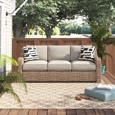 Sporting an easy-on-the-eyes look inspired by driftwood, this sofa is the perfect pick for your patio or deck! Founded atop a powder-coated aluminum frame wrapped in all-weather resin wicker, this sofa is topped off with plush and inviting, removable beige cushions wrapped in weatherproof and stain- and fade-resistant fabric that’s a breeze to keep clean. This is assembled in the USA with global components. | Beachcrest Home™ Danny 82.75" Wide Wicker Patio Sofa w/ Cushions Wicker/Rattan in Brown 3 Seater Outdoor Sofa, Outdoor L Shaped Couch, Hawaii Condo, Outdoor Wicker Rocking Chairs, Sofa With Cushions, Rockaway Beach, Cozy Outdoor, Outdoor Couch, Boat Stuff