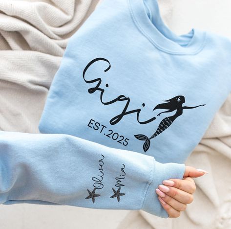 Personalized Gigi Mermaid Sweatshirt, Gigi With Grandkids Names Crewneck, Gift For Her, Custom Hoodie, Gift For Grandma, Grandmother Gift * High quality and super soft, comfortable shirt. Made with top-of-the-line vinyl and pressed with a professional grade heat press. * Please check all color and size charts before place the order. *We're working with different shirt brands based on the color/size availability. All shirts we use are soft style, not heavy cotton. Solid colors are all cotton and heather colors are cotton/poly blend. (there may be exceptions) * Shirts are unisex sizing. It's comfortable and flattering for men and women, but may run a little large for the ladies. Please refer to the sizing chart to find your perfect fit. Please order your normal size for a regular fit, or siz