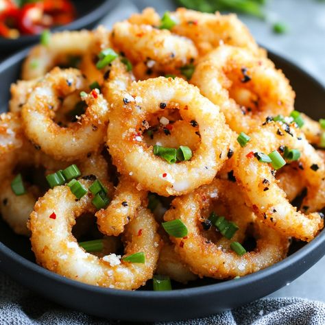 🦑 Crispy perfection! Try our Extra Crispy Salt and Pepper Squid for a delightful crunch! 🦑 #CrispySquid #SeafoodLovers Extra Crispy Salt and Pepper Squid Ingredients: Squid (500g, cleaned and cut into rings) Cornstarch (1 cup) Salt (1 tsp) Black pepper (1 tsp) Garlic powder (1 tsp) Oil (for frying) Green onions (for garnish) Red chili (for garnish) Instructions: Mix cornstarch, salt, black pepper, and garlic powder. Coat squid rings in the mixture. Fry until golden and crispy. Drain on pa... Squid Rings, Salt And Pepper Squid, Instagram Recipes, Trending Recipes, Frying Oil, Red Chili, Green Onions, Fantastic Beasts, Frying